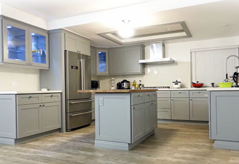 light gray Shaker cabinets with wood countertop